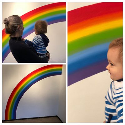 Collage muurschildering regenboog
